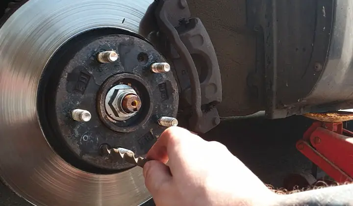 Remove Brake Pad Retaining Rings and Bolts