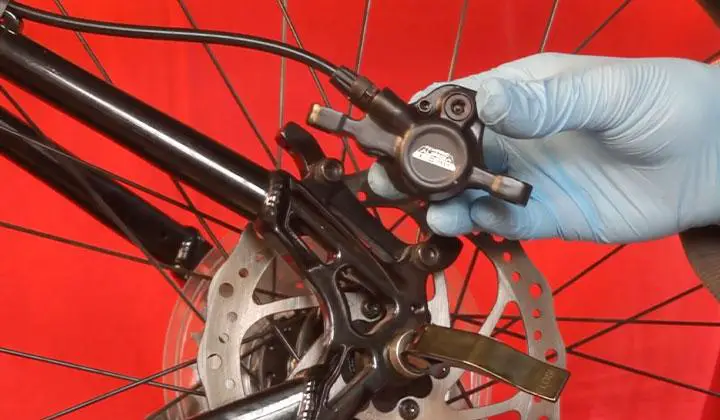 Remove any existing fluid from the calipers
