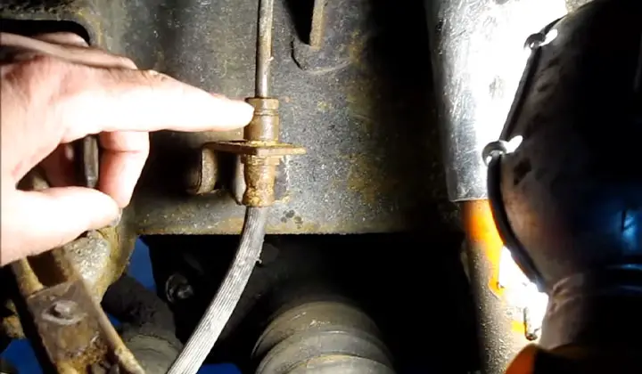 Disconnect the Hoses from the Caliper